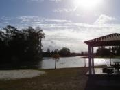 Charley Mathney Park pavilion with Lake Camille in the background