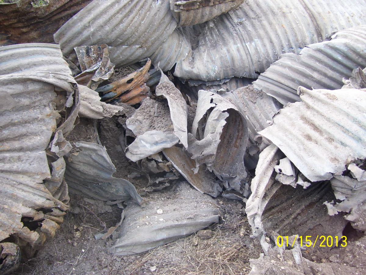 Destroyed pile of culvert material after removal